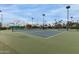 A serene shot of the outdoor tennis courts offers a scenic setting for sports enthusiasts at 14008 N 61St Ave, Glendale, AZ 85306