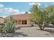 Exterior of a home displaying its backyard with desert landscaping and rock ground cover at 14432 W Yukon Dr, Sun City West, AZ 85375