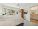 Bedroom with a bay window, wooden armoire, and a view of the backyard at 14432 W Yukon Dr, Sun City West, AZ 85375