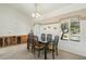 Elegant dining room with ample natural light and seating for six people at 14432 W Yukon Dr, Sun City West, AZ 85375