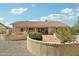 Exterior of a home featuring a large patio area and rock landscaping for low maintenance upkeep at 14432 W Yukon Dr, Sun City West, AZ 85375