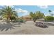 House's front yard featuring desert landscaping with various plants and a scattering of rocks at 14432 W Yukon Dr, Sun City West, AZ 85375