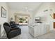 Bright living room with sliding glass doors and comfortable seating arrangement at 14432 W Yukon Dr, Sun City West, AZ 85375