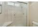 Modern shower with glass door and corner seat at 14432 W Yukon Dr, Sun City West, AZ 85375