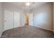 A cozy bedroom featuring soft carpet, a closet, and a calming color scheme for restful nights at 14616 W Ventura St, Surprise, AZ 85379