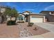 Charming single-story home with manicured front yard, desert landscaping, and inviting curb appeal at 14616 W Ventura St, Surprise, AZ 85379