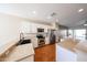 Modern kitchen featuring stainless steel appliances, white cabinets, and an open layout at 14616 W Ventura St, Surprise, AZ 85379