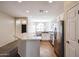 Spacious kitchen featuring white cabinetry, stainless steel appliances, and an open layout at 14616 W Ventura St, Surprise, AZ 85379