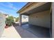 A covered patio offers a relaxing outdoor space with views of the backyard and surrounding landscape at 14616 W Ventura St, Surprise, AZ 85379