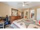 Cozy bedroom featuring a dresser, closet, en-suite bathroom, ceiling fan, and natural light at 14910 N Kings Way # 101, Fountain Hills, AZ 85268