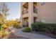 Exterior view of a condo building with desert landscaping at 14910 N Kings Way # 101, Fountain Hills, AZ 85268