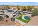 A bird's eye view of a backyard with sparkling pool and cozy hammock, perfect for relaxation at 151 N 116Th Dr, Avondale, AZ 85323