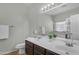 Bathroom featuring double sinks, modern vanity, and a shower/tub combination at 151 N 116Th Dr, Avondale, AZ 85323