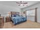 Cozy bedroom with carpet flooring, ceiling fan, and natural light at 151 N 116Th Dr, Avondale, AZ 85323