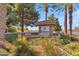 Attractive community entrance sign surrounded by manicured landscaping and mature palm trees at 151 N 116Th Dr, Avondale, AZ 85323