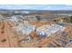 Wide aerial view of construction site featuring roller coaster, hotel, and stadium at 151 N 116Th Dr, Avondale, AZ 85323