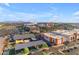 An aerial view of an entertainment district featuring dining, sports, and a stadium in the distance at 151 N 116Th Dr, Avondale, AZ 85323