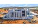 An exterior aerial view of a modern hotel construction site, showcasing its architectural design at 151 N 116Th Dr, Avondale, AZ 85323