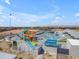 Expansive community water park featuring slides, pools, and sunshades for Gathering fun at 151 N 116Th Dr, Avondale, AZ 85323