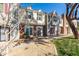 A charming two-story townhome with a well-manicured lawn and brick accents on the facade at 1600 N Saba St # 191, Chandler, AZ 85225