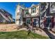 A well-kept two-story townhome featuring a manicured front yard, brick, and an inviting entrance at 1600 N Saba St # 191, Chandler, AZ 85225