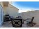 Outdoor patio featuring a seating area, grill, and privacy wall for relaxing and entertaining at 1600 N Saba St # 191, Chandler, AZ 85225