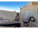 Cozy patio with comfortable seating, a side entrance, and privacy wall for outdoor enjoyment at 1600 N Saba St # 191, Chandler, AZ 85225