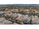 An aerial view of a community with homes, streets, and desert landscaping at 16102 W Miami St, Goodyear, AZ 85338