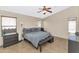 Main bedroom with ceiling fan, tile floors, and window blinds at 16102 W Miami St, Goodyear, AZ 85338