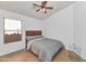 Comfortable bedroom with a queen size bed, ceiling fan, and neutral decor at 16102 W Miami St, Goodyear, AZ 85338