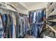 Walk in closet with hanging clothes on rods, and shelving at 16102 W Miami St, Goodyear, AZ 85338