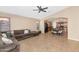 Open concept living room with ceiling fan, and tile floors at 16102 W Miami St, Goodyear, AZ 85338