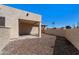 Backyard with stucco wall, rock landscaping, and covered patio at 1612 Leisure World --, Mesa, AZ 85206