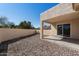 Backyard featuring a covered patio and rock landscaping at 1612 Leisure World --, Mesa, AZ 85206