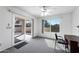 Bright bedroom with ceiling fan, carpet, and a sliding door leading to the patio at 1612 Leisure World --, Mesa, AZ 85206