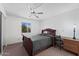 Bedroom featuring a ceiling fan, closet, and window at 1612 Leisure World --, Mesa, AZ 85206