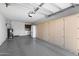 Garage featuring built-in cabinets, washer/dryer, and a refrigerator at 1612 Leisure World --, Mesa, AZ 85206