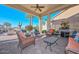 Covered patio featuring comfortable outdoor seating, a BBQ, and ceiling fan at 16409 W Alvarado Dr, Goodyear, AZ 85395