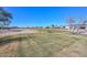 Scenic view of the lush green golf course, offering a tranquil and picturesque backdrop to the property at 16409 W Alvarado Dr, Goodyear, AZ 85395