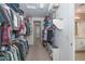 Spacious walk-in closet with ample shelving and hanging space for clothes and accessories at 16409 W Alvarado Dr, Goodyear, AZ 85395