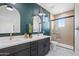 Beautiful bathroom featuring a double sink vanity and a glass shower at 1642 E Monte Vista Rd # 9, Phoenix, AZ 85006