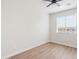 Bright bedroom with a large window and wood-look flooring at 1642 E Monte Vista Rd # 9, Phoenix, AZ 85006