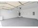 Spacious two car garage with white walls and epoxy flooring at 1642 E Monte Vista Rd # 9, Phoenix, AZ 85006