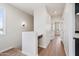 Bright second-story hallway with light hardwood floors, white walls, and built-in desk at 1642 E Monte Vista Rd # 9, Phoenix, AZ 85006