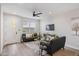 Inviting living room featuring modern decor, wood flooring, and an open layout connected to the entry door at 1642 E Monte Vista Rd # 9, Phoenix, AZ 85006