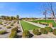 Bocce court surrounded by desert landscaping and park benches at 17138 W Las Palmaritas Dr, Waddell, AZ 85355