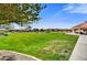 A community green space featuring a walking path and gazebo set among grassy landscaping at 17138 W Las Palmaritas Dr, Waddell, AZ 85355