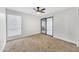 Inviting bedroom with plush carpeting, ceiling fan, and sliding door to the outdoors at 17211 N 35Th Ave, Phoenix, AZ 85053