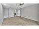 Carpeted bedroom features fresh paint and ample space, complemented by a ceiling fan for added comfort at 17211 N 35Th Ave, Phoenix, AZ 85053