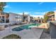 Community pool and hot tub surrounded by lounging area and well-maintained landscaping at 17211 N 35Th Ave, Phoenix, AZ 85053